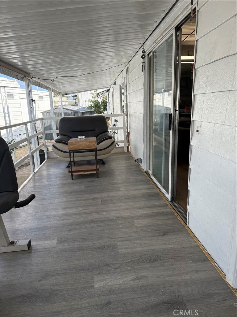 4117 West McFadden Avenue Santa Ana, CA 92704 - Photo 21 of 26 a living room with furniture and a wooden floor