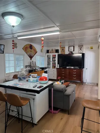 a room with furniture and a flat screen tv