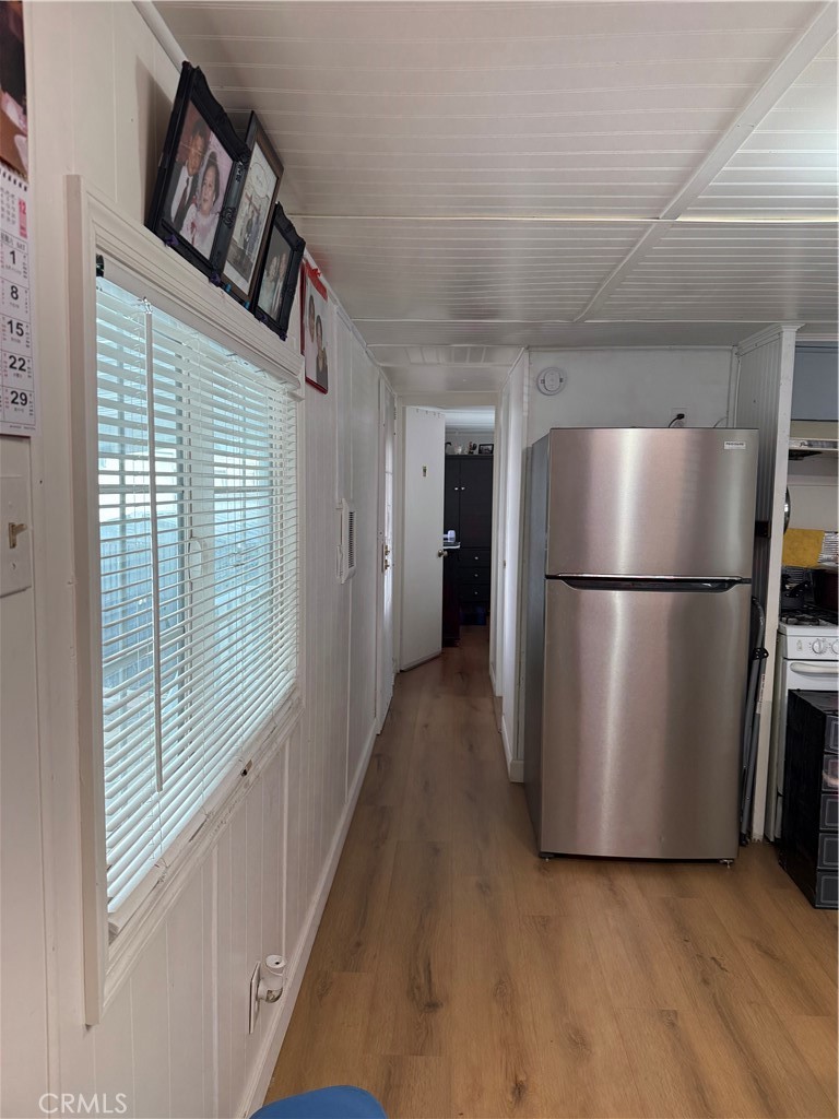 4117 West McFadden Avenue Santa Ana, CA 92704 - Photo 5 of 26 a view of kitchen with furniture and refrigerator