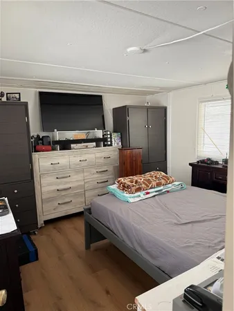 a bedroom with a bed and furniture