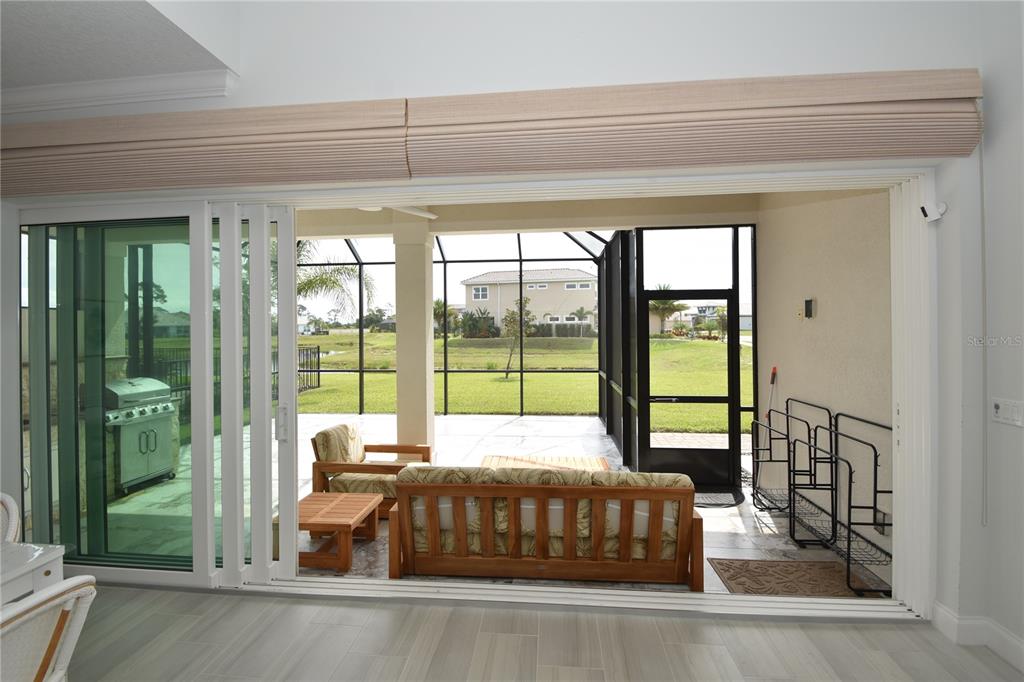 114 Del Palma Drive Palm Coast, FL 32137 - Photo 19 of 63 a bedroom with a bed and a large window