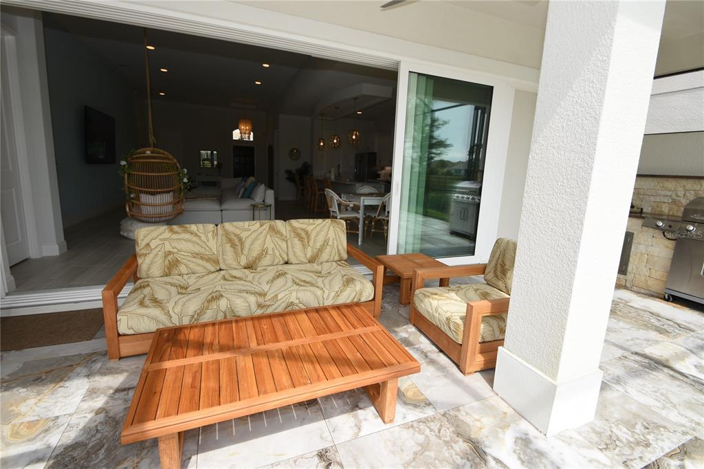 114 Del Palma Drive Palm Coast, FL 32137 - Photo 22 of 63 a living room with furniture and a large window