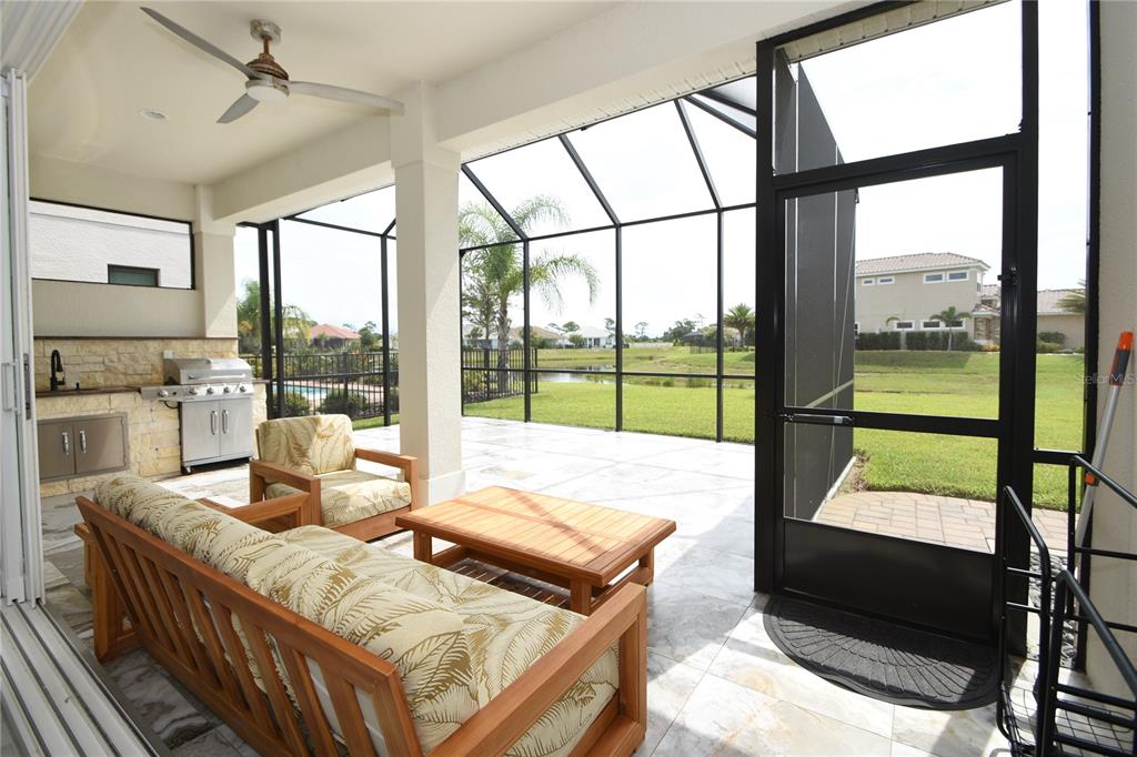 114 Del Palma Drive Palm Coast, FL 32137 - Photo 24 of 63 a living room with couch and a flat screen tv