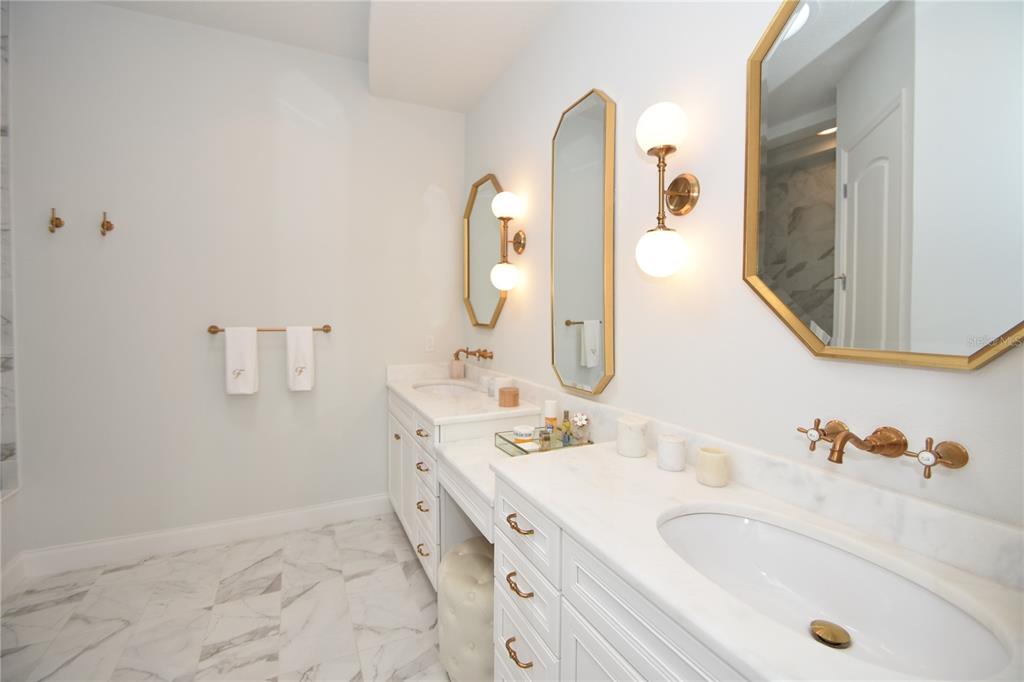 114 Del Palma Drive Palm Coast, FL 32137 - Photo 30 of 63 a bathroom with a sink and a mirror