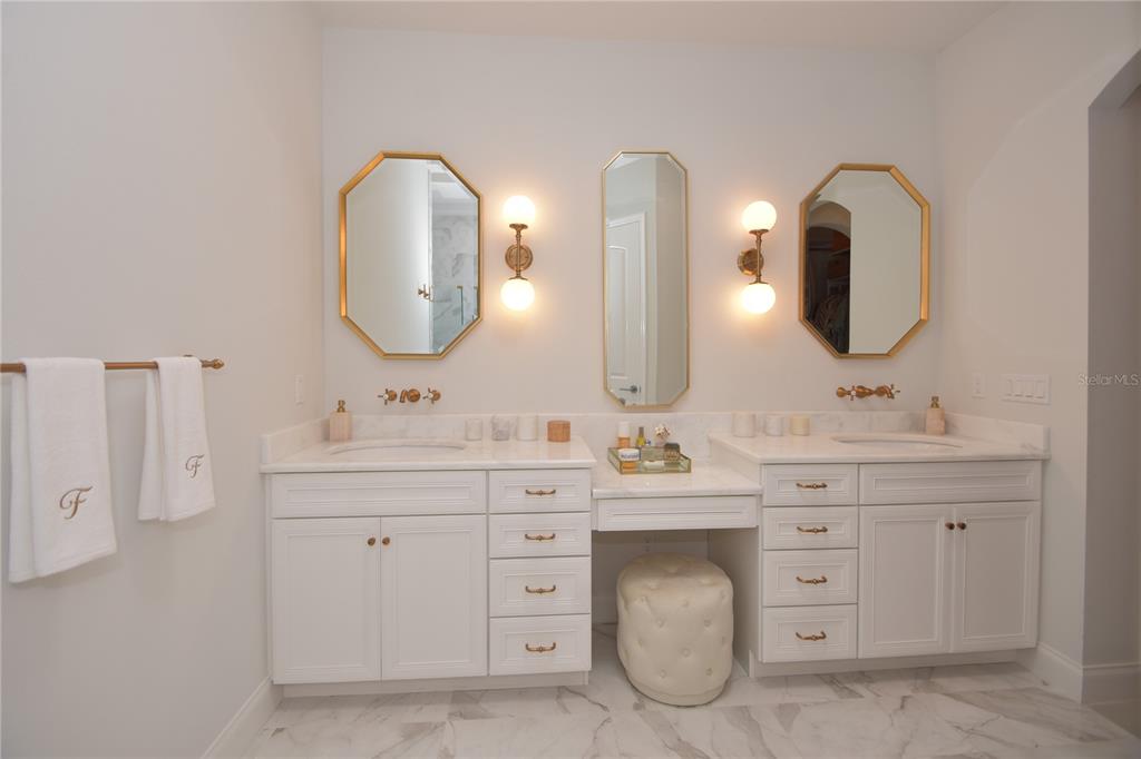 114 Del Palma Drive Palm Coast, FL 32137 - Photo 31 of 63 a bathroom with a double vanity sink double and a mirror