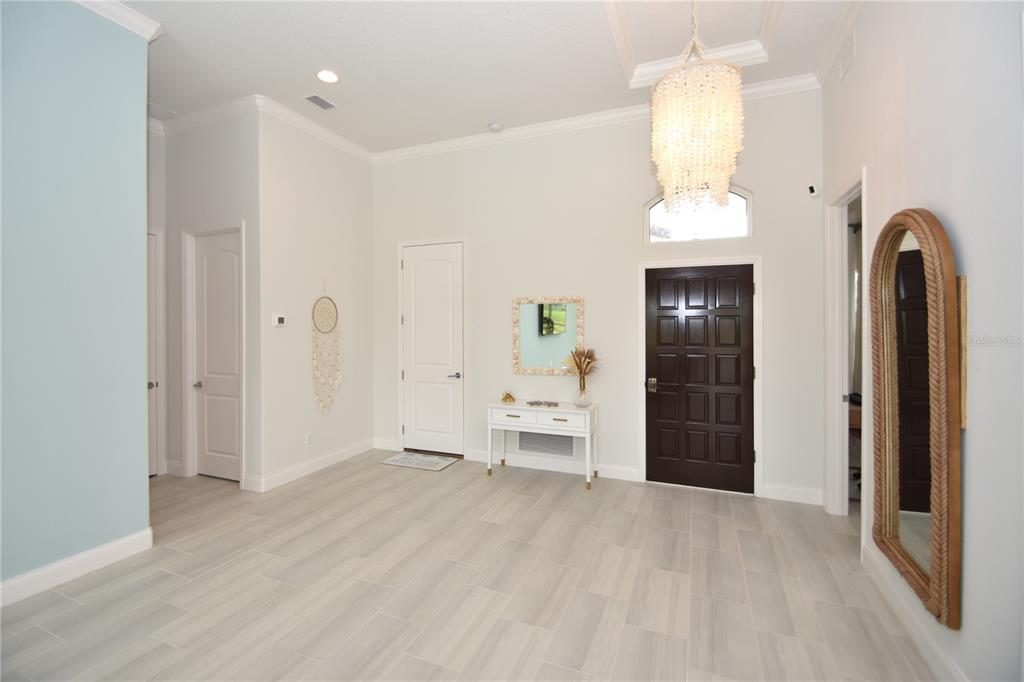 114 Del Palma Drive Palm Coast, FL 32137 - Photo 37 of 63 a view of empty room with wooden floor