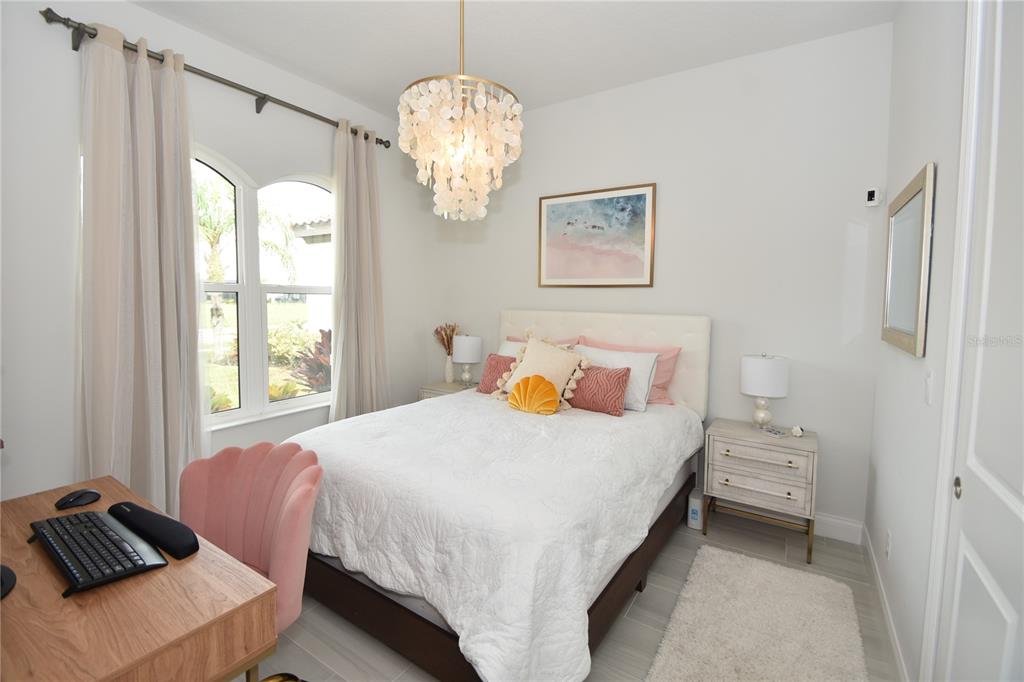 114 Del Palma Drive Palm Coast, FL 32137 - Photo 39 of 63 a bedroom with a bed and window