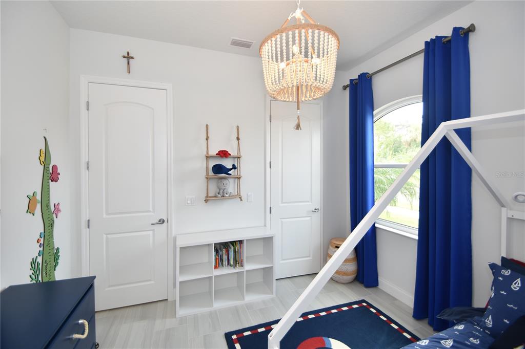 114 Del Palma Drive Palm Coast, FL 32137 - Photo 43 of 63 a view of entryway and hall with wooden floor