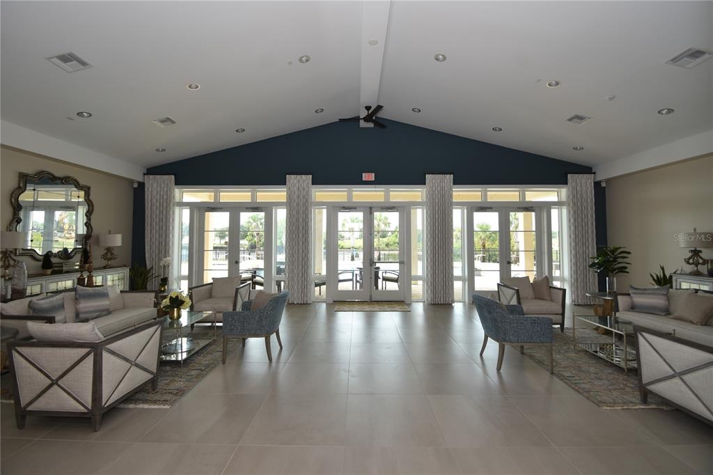 114 Del Palma Drive Palm Coast, FL 32137 - Photo 54 of 63 a living room with furniture and a large window