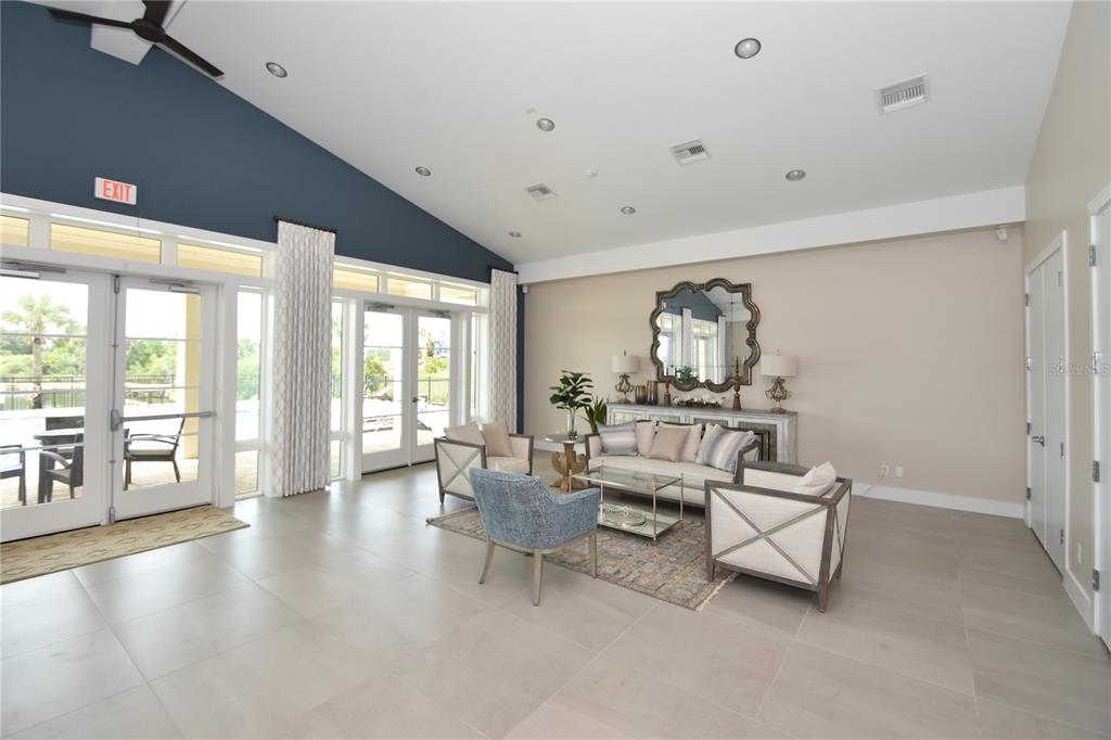 114 Del Palma Drive Palm Coast, FL 32137 - Photo 56 of 63 a living room with furniture and a large window