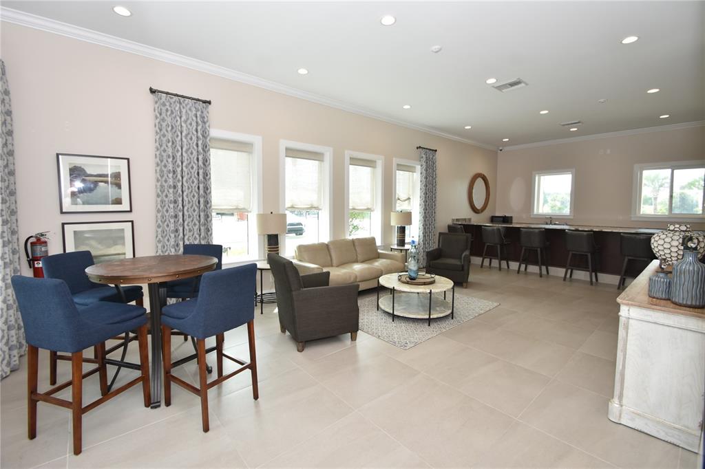 114 Del Palma Drive Palm Coast, FL 32137 - Photo 58 of 63 a living room with furniture and a dining table