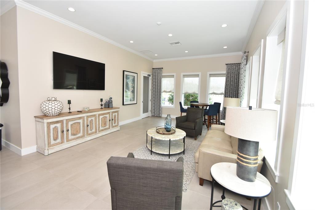 114 Del Palma Drive Palm Coast, FL 32137 - Photo 59 of 63 a living room with furniture and a flat screen tv