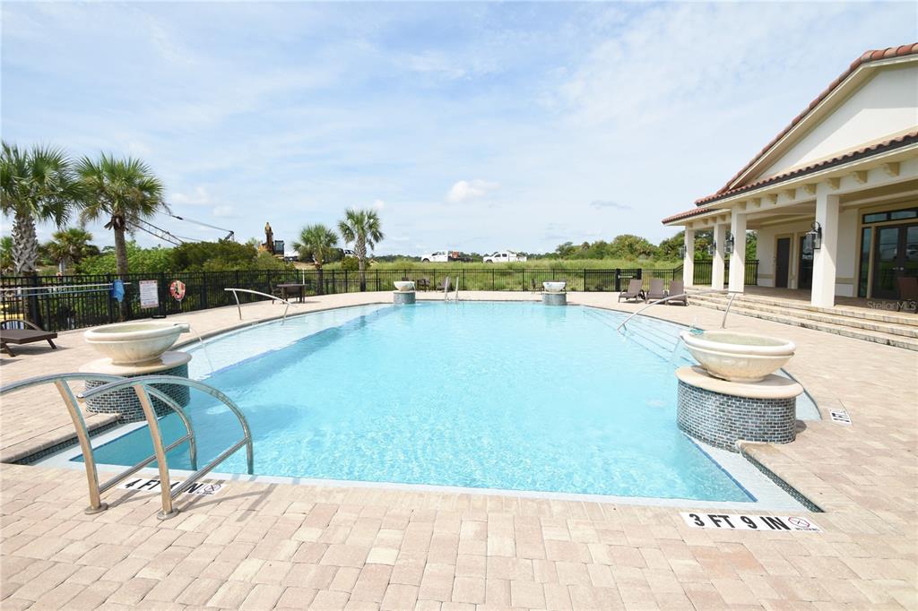 114 Del Palma Drive Palm Coast, FL 32137 - Photo 61 of 63 a view of swimming pool with outdoor seating and plants