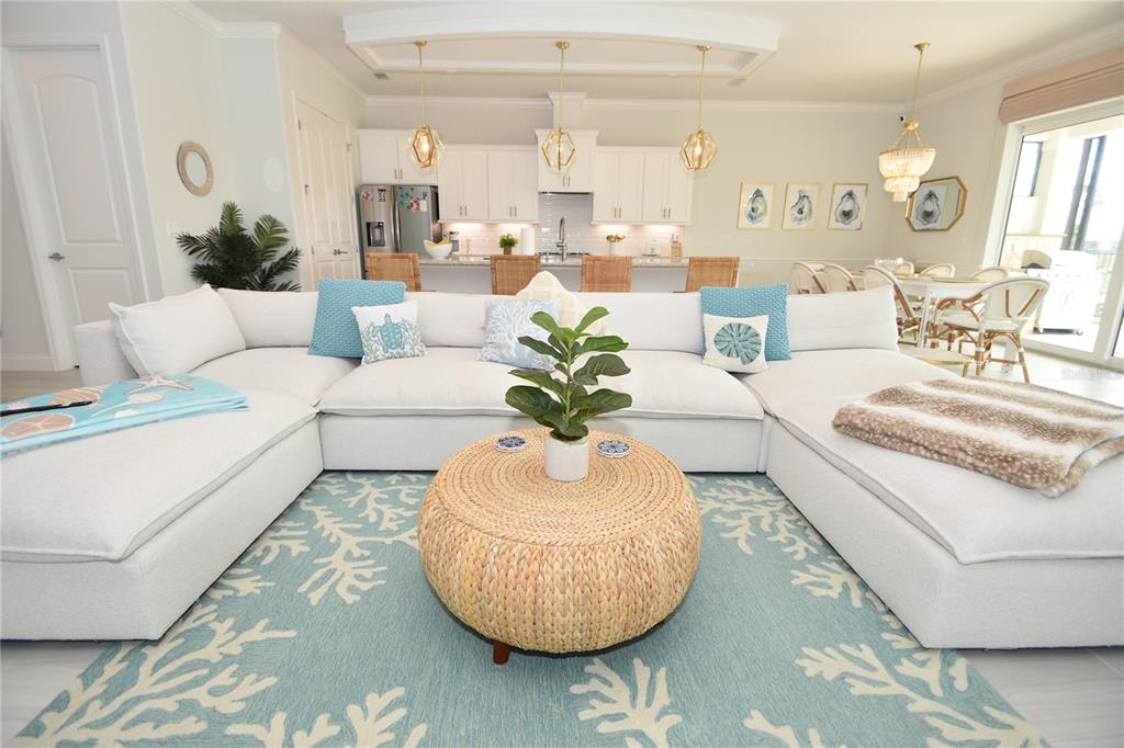 114 Del Palma Drive Palm Coast, FL 32137 - Photo 7 of 63 a living room with furniture bathtub and a chandelier