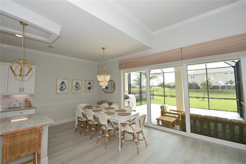 114 Del Palma Drive Palm Coast, FL 32137 - Photo 9 of 63 a view of a dining room with furniture window and outside view