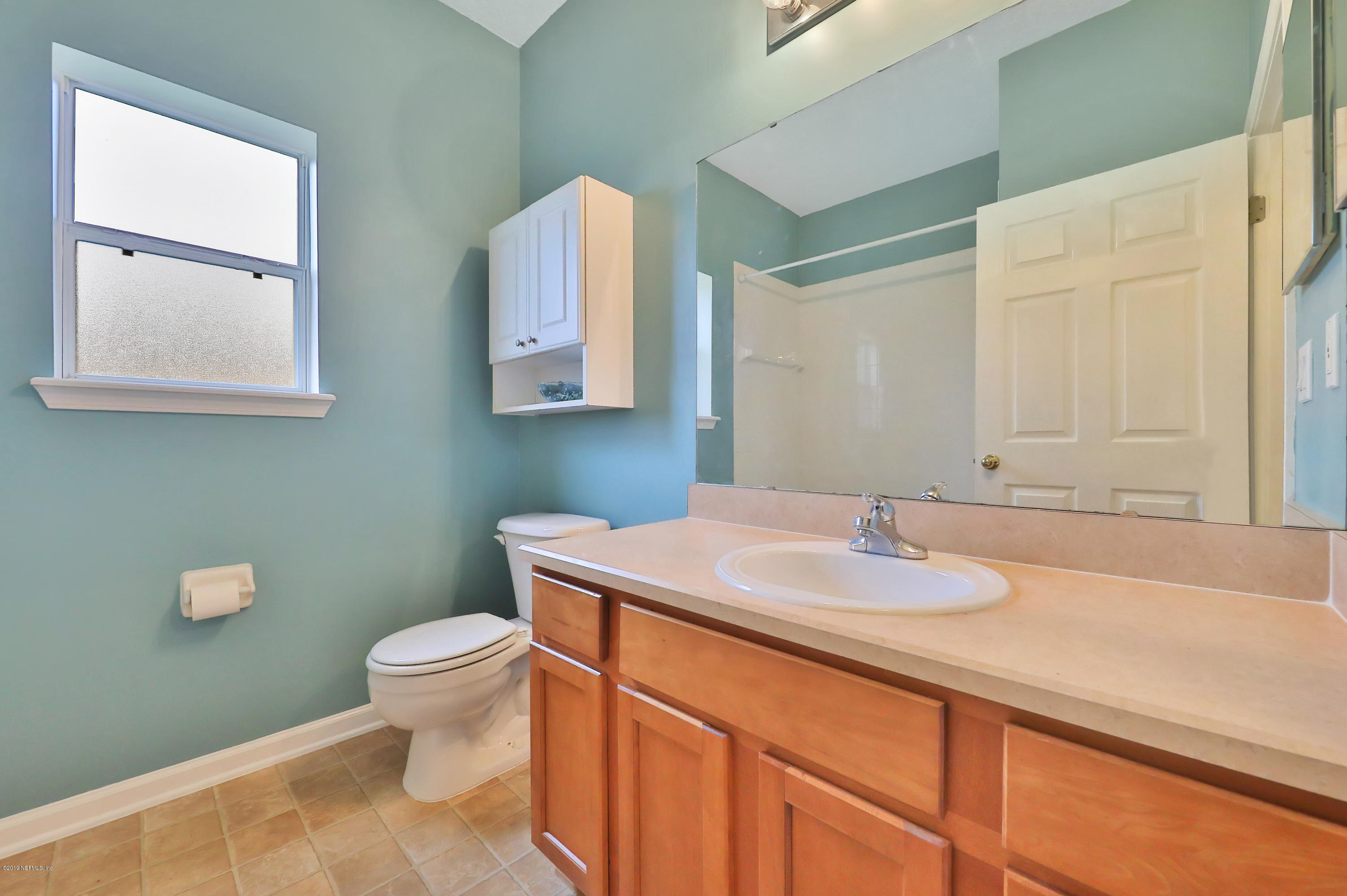 9189 Raptor Drive Jacksonville, FL 32221 - Photo 6 of 23 a bathroom with a sink and a toilet