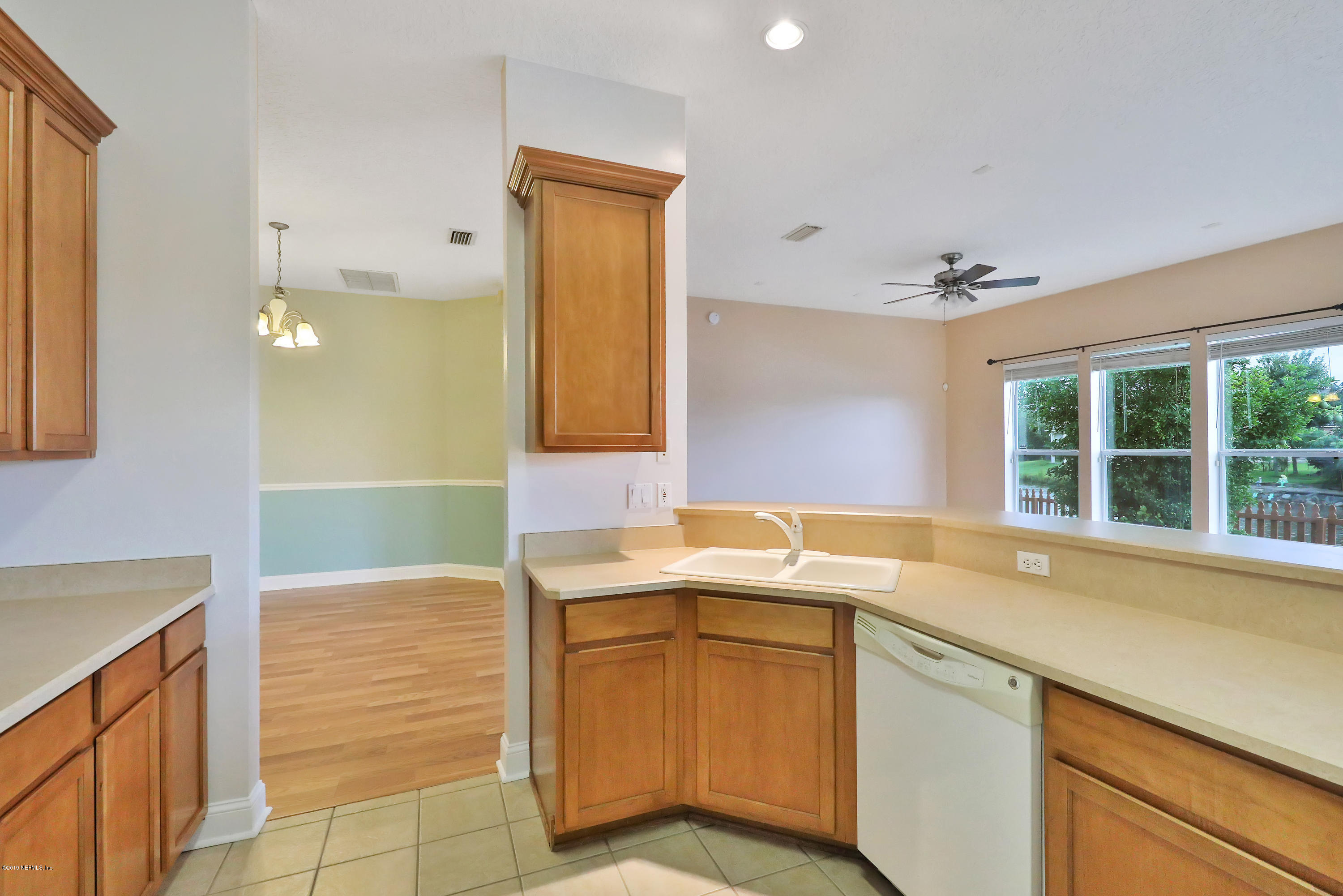 9189 Raptor Drive Jacksonville, FL 32221 - Photo 9 of 23 a bathroom with a sink and a mirror