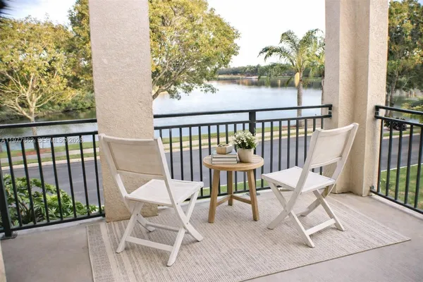 a view of a chairs and table in patio