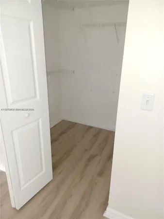 a white toilet sitting next to a bath tub and a shower