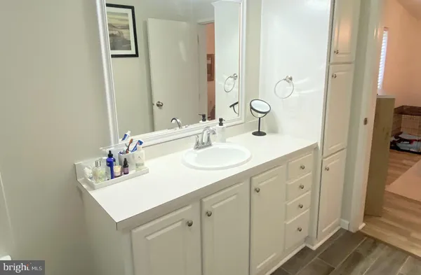 a bathroom with a sink and a mirror