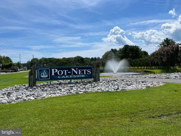 a view of a wooden fence and a big yard