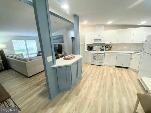 a open kitchen with sink cabinets and refrigerator