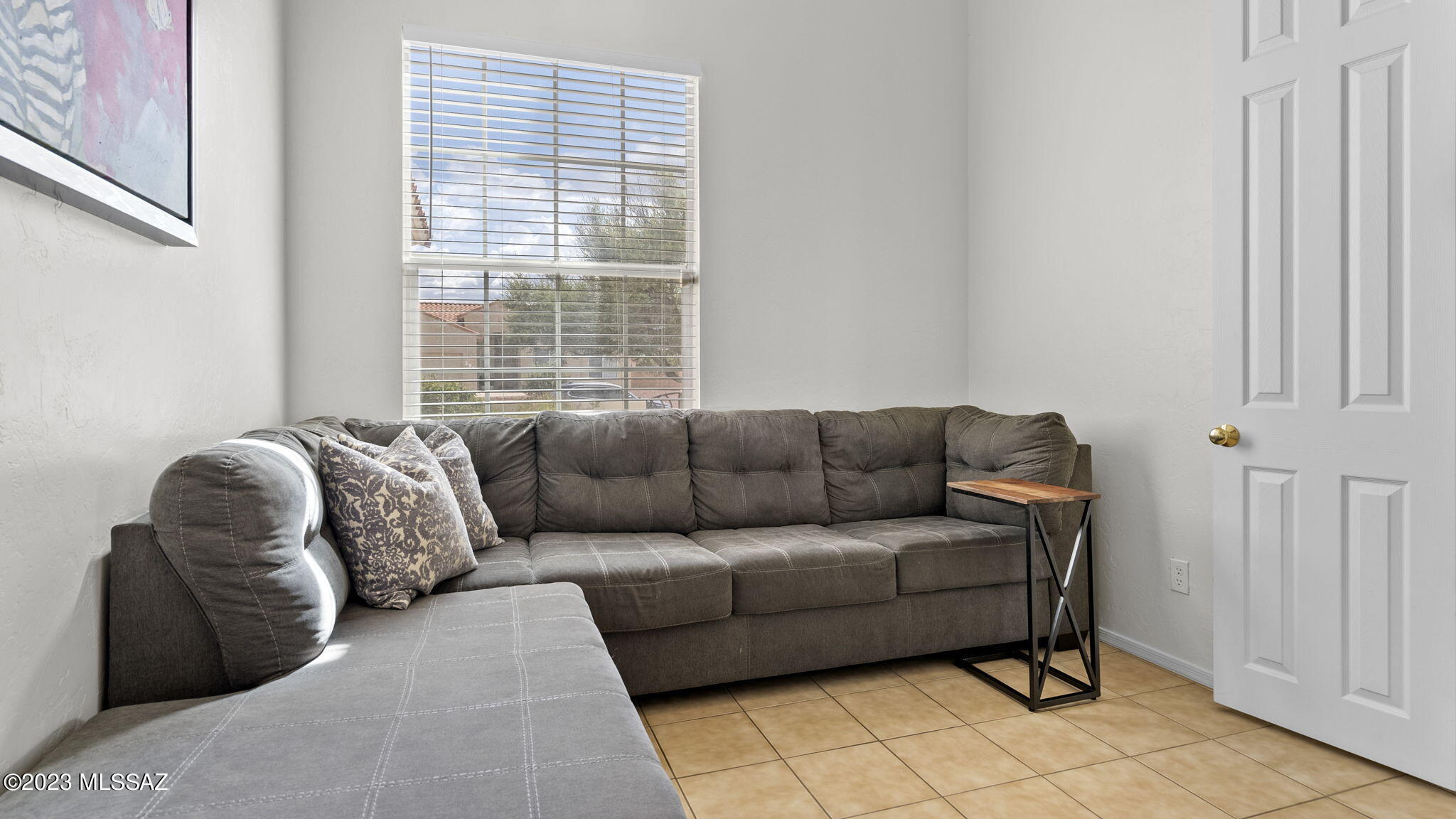 401 Via Capri Rio Rico, AZ 85648 - Photo 12 of 38 a living room with furniture and a window