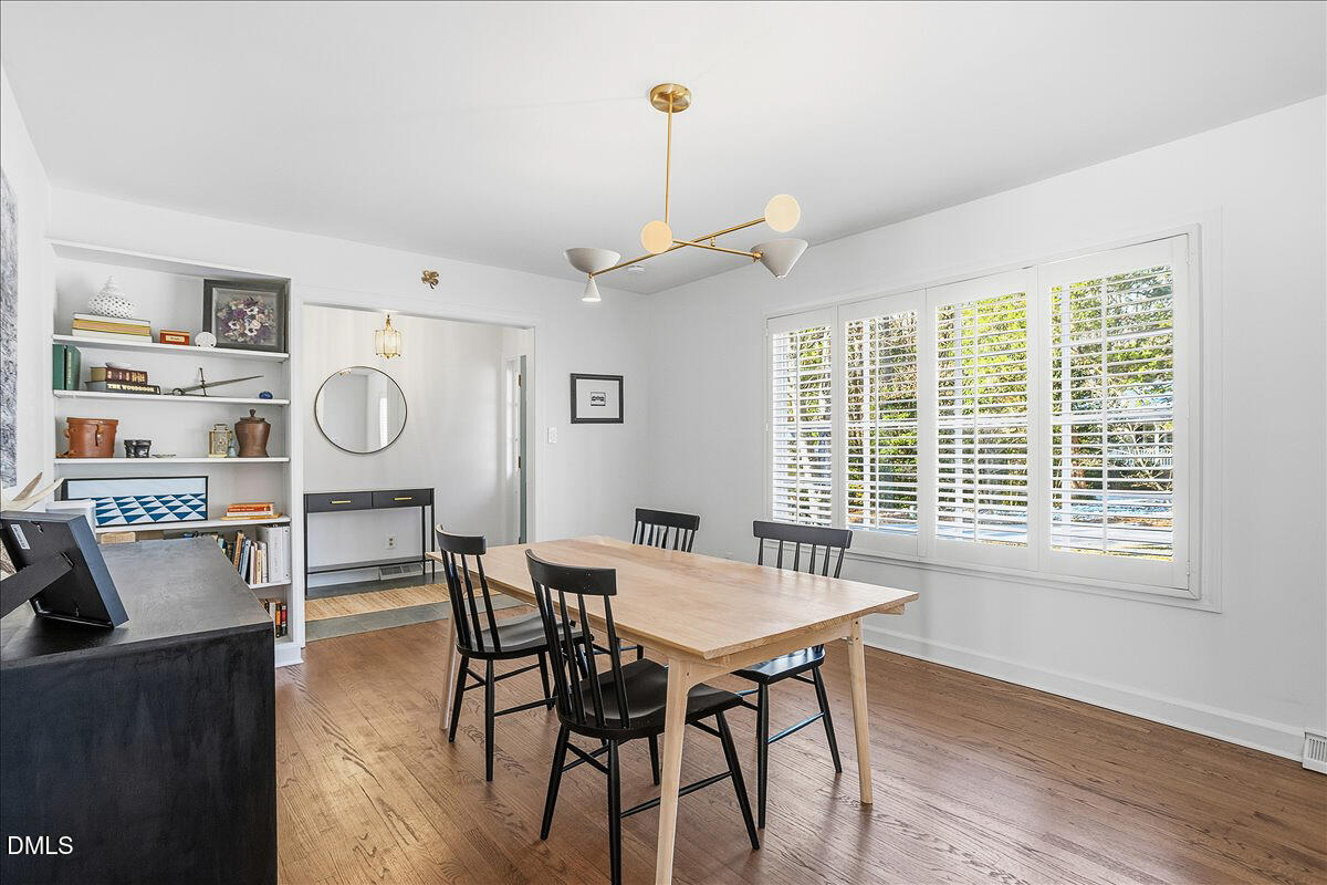 5904 Volant Drive Raleigh, NC 27609 - Photo 9 of 42 a view of a dining room with furniture window and wooden floor