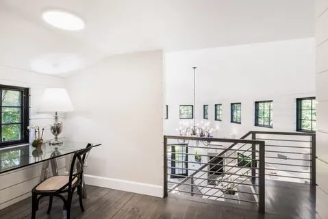 a view of a livingroom with furniture window and wooden floor