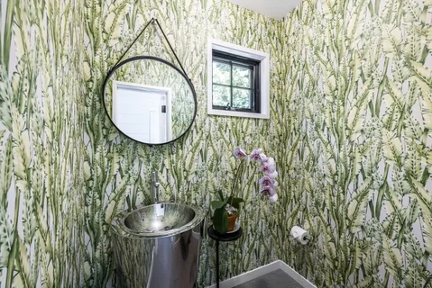a bathroom with a sink and mirror