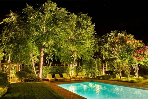 a patio with water view and outdoor seating