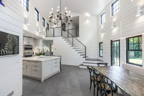 a kitchen with cabinets and window
