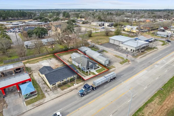 an aerial view of residential houses with outdoor space