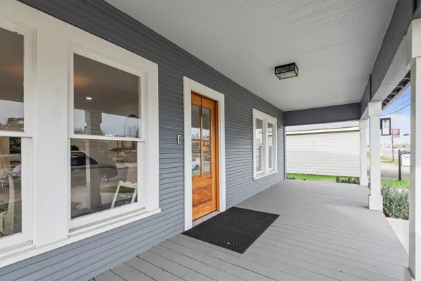 a view of an entryway of house with wooden floor