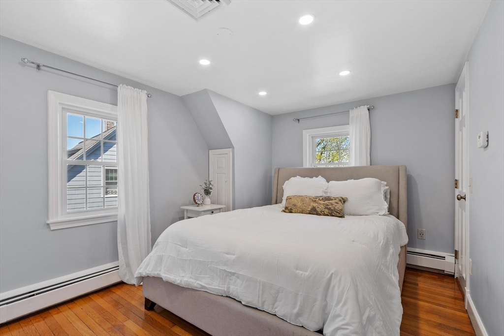 25 Naples Road Melrose, MA 02176 - Photo 15 of 36 a bedroom with a bed and a window