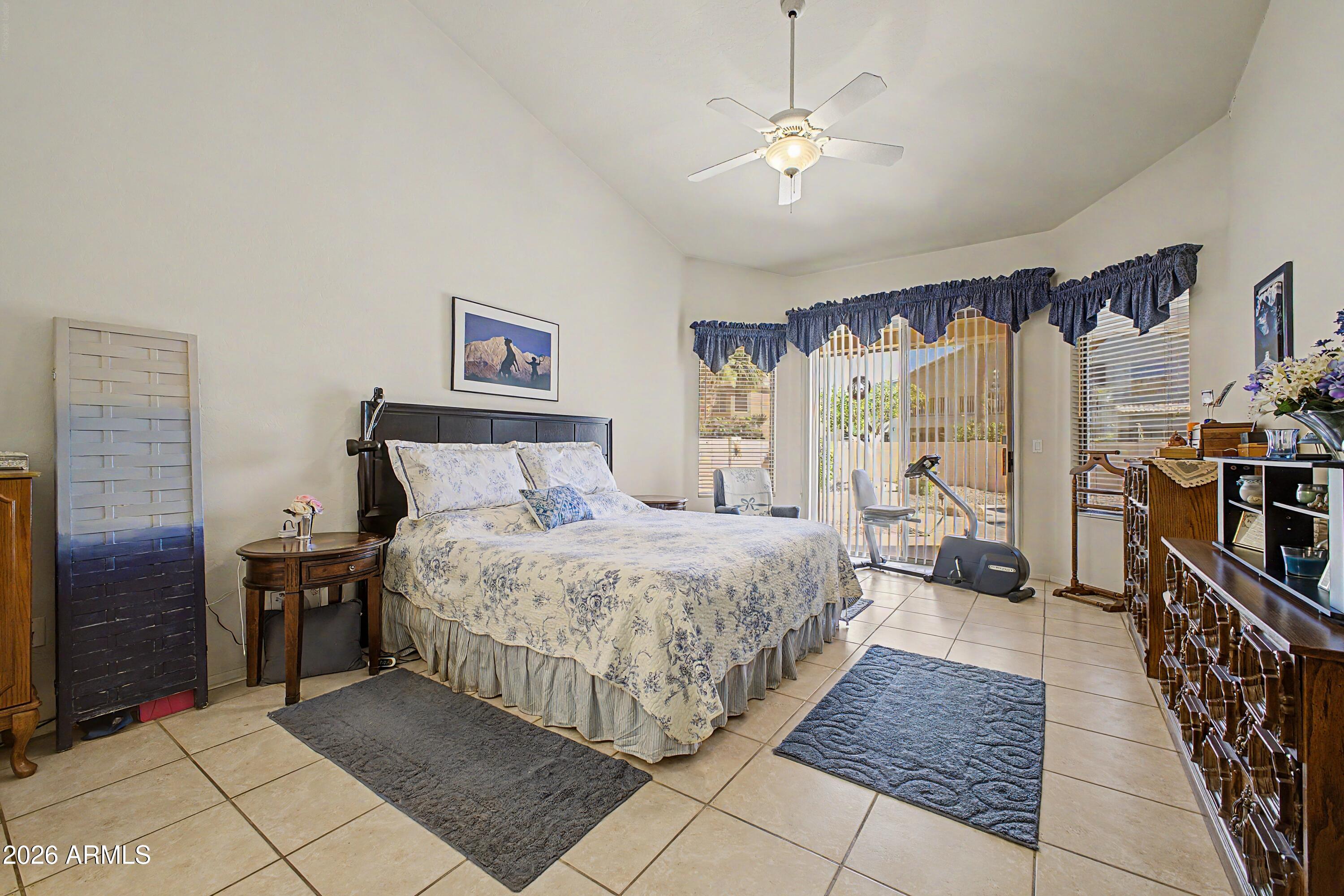 433 West Desert Avenue Gilbert, AZ 85233 - Photo 10 of 23 a spacious bedroom with a bed and a walk in closet