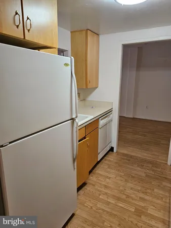 a kitchen with stainless steel appliances a refrigerator and a stove