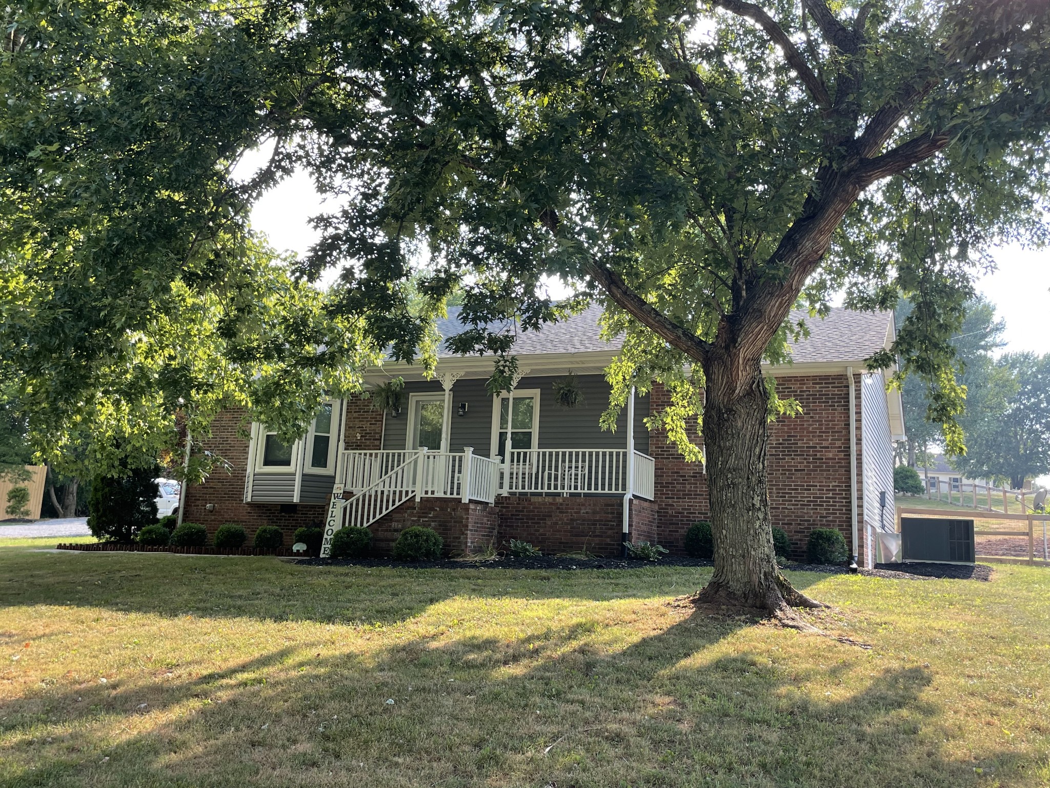 2768 Henry Gower Road Pleasant View, TN 37146 - Photo 4 of 45 a view of a house with a tree in a yard
