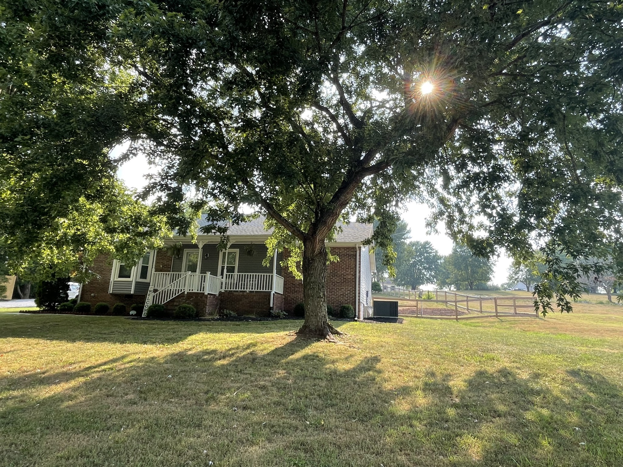 2768 Henry Gower Road Pleasant View, TN 37146 - Photo 5 of 45 a front view of a house with a yard