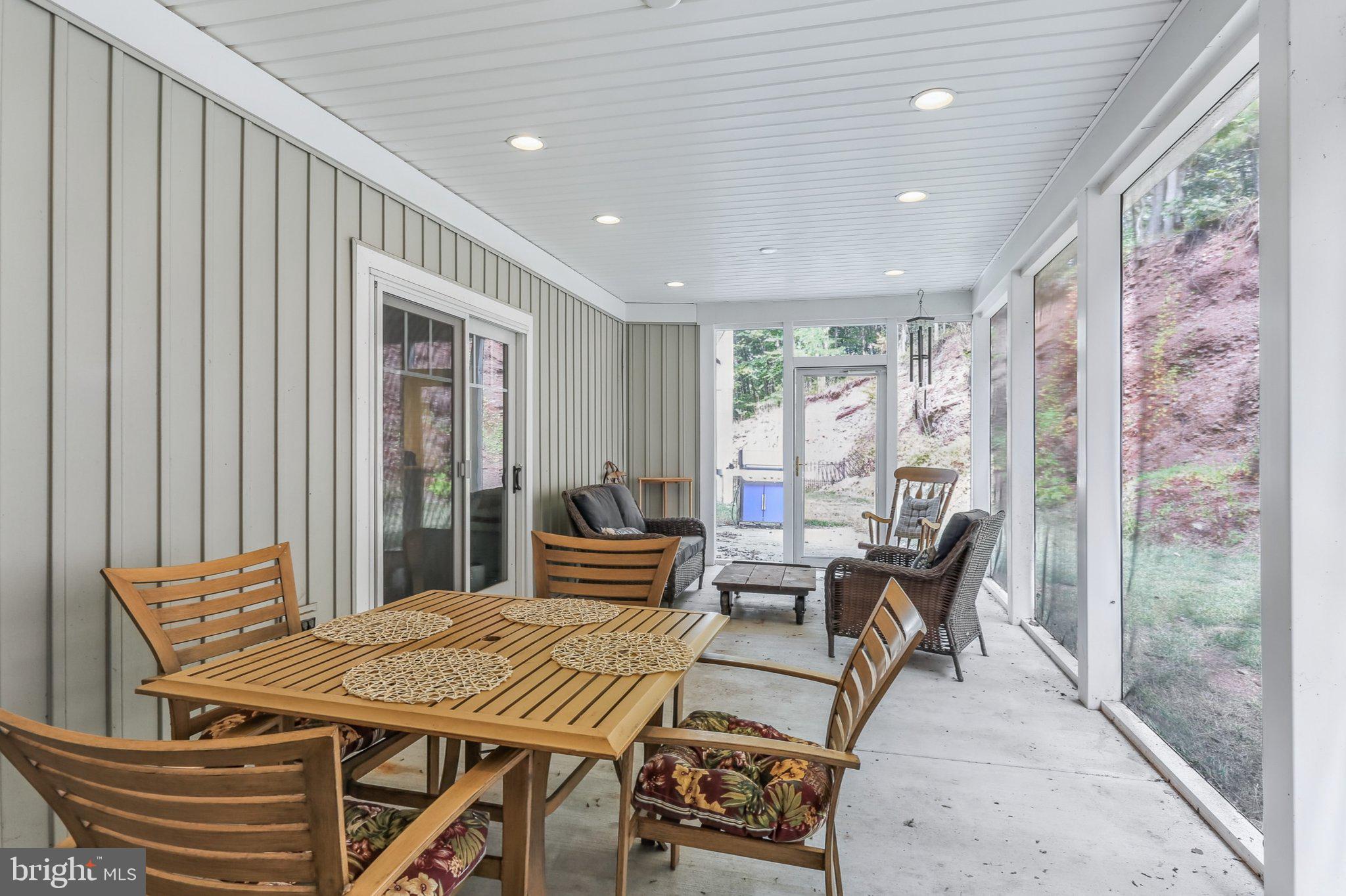 6 Maple Grove Road Mohnton, PA 19540 - Photo 42 of 55 Serene sunlit porch retreat.