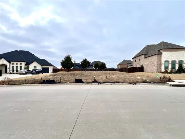 a view of swimming pool with outdoor seating and house in the background