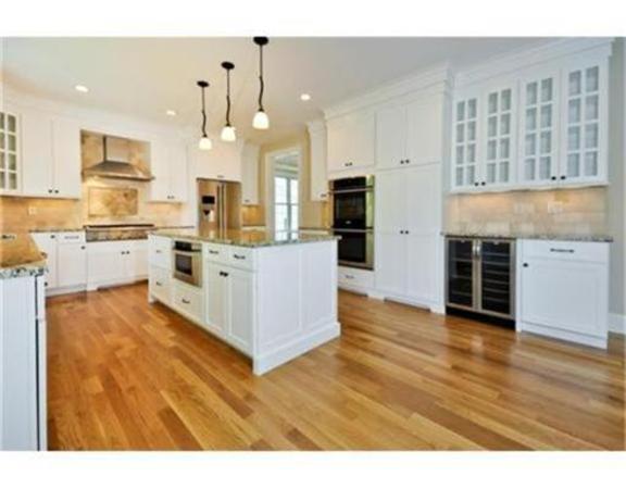 105 Damon Road Needham, MA 02494 - Photo 2 of 7 a large kitchen with cabinets and wooden floor