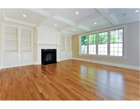 105 Damon Road Needham, MA 02494 - Photo 3 of 7 a view of an empty room with a fireplace and a window
