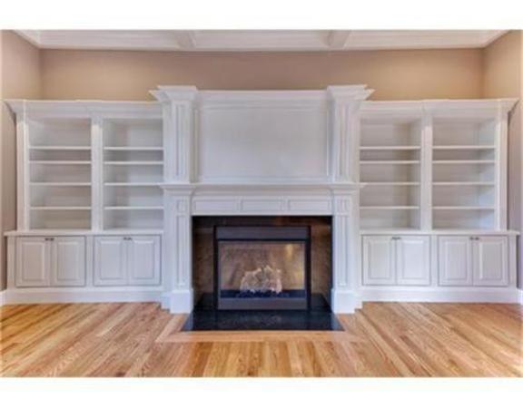 105 Damon Road Needham, MA 02494 - Photo 4 of 7 a living room with a fireplace cabinet and a fireplace