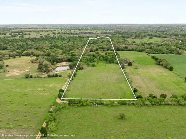 a view of a field with an ocean