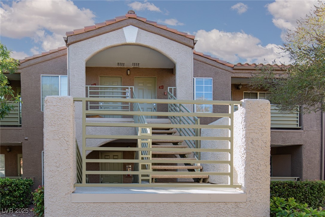 7720 Secret Shore Drive, Unit 207 Las Vegas, NV 89128 - Photo 5 of 21 Unit 207 is the door on the right.