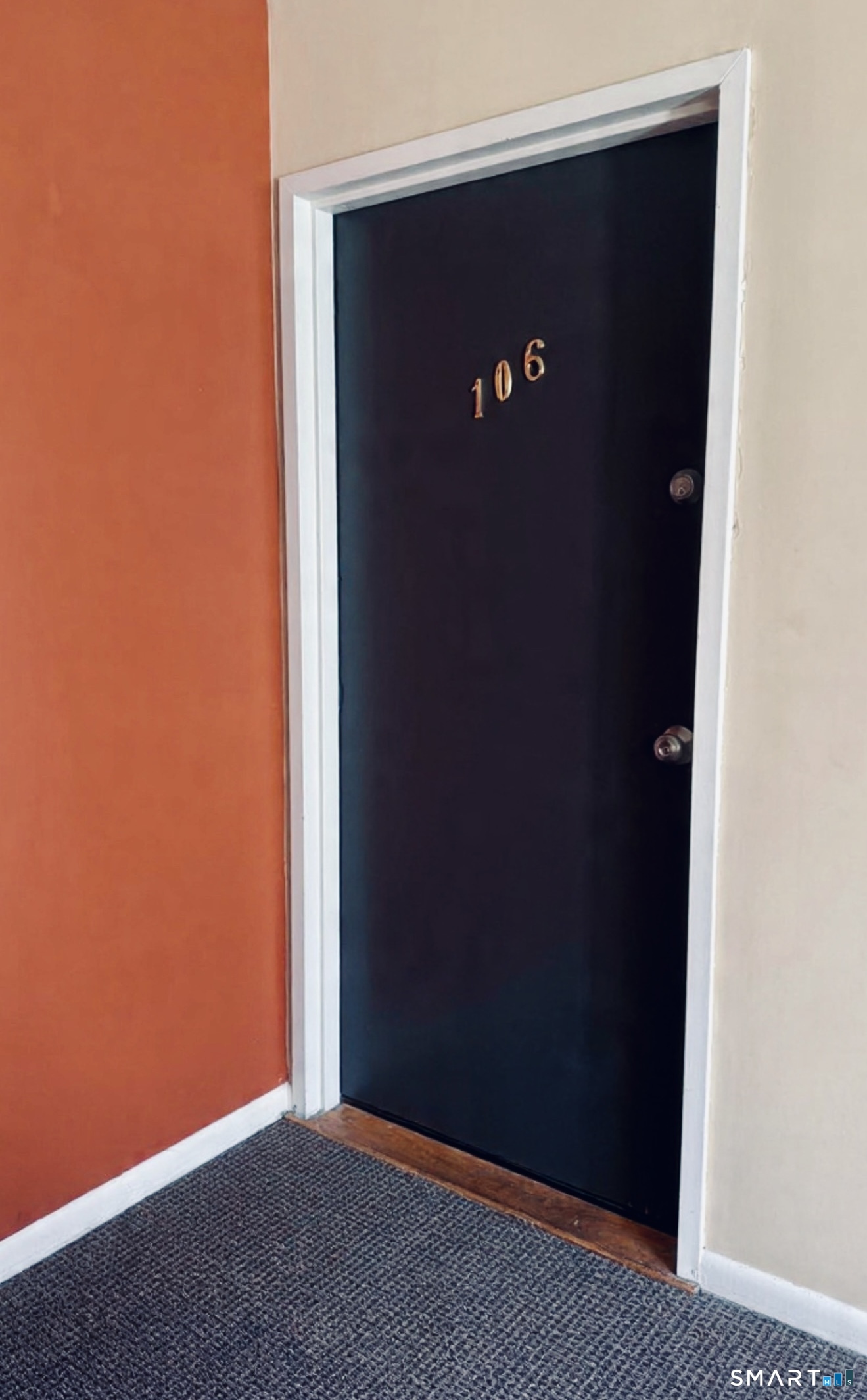 175 Mill Pond Road, Unit 106 Hamden, CT 06514 - Photo 20 of 22 an empty room with a door