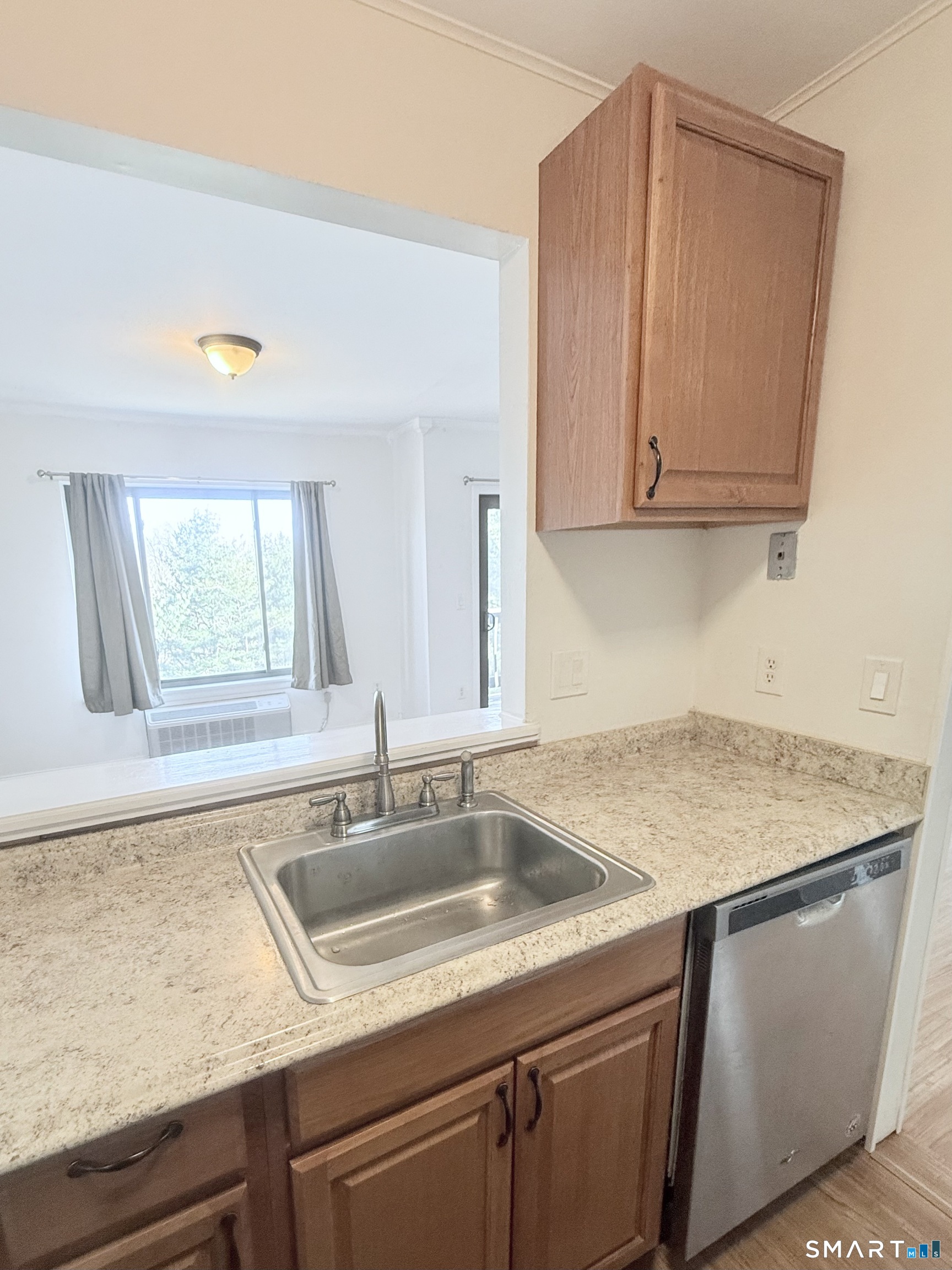 175 Mill Pond Road, Unit 106 Hamden, CT 06514 - Photo 10 of 22 a kitchen with a sink cabinets and window