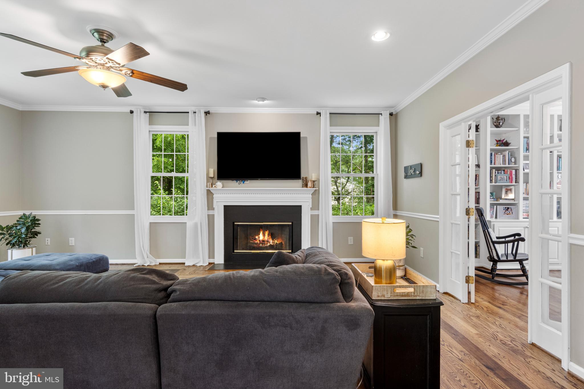 427 Buttonwood Road Landenberg, PA 19350 - Photo 22 of 82 a living room with furniture a flat screen tv and a fireplace