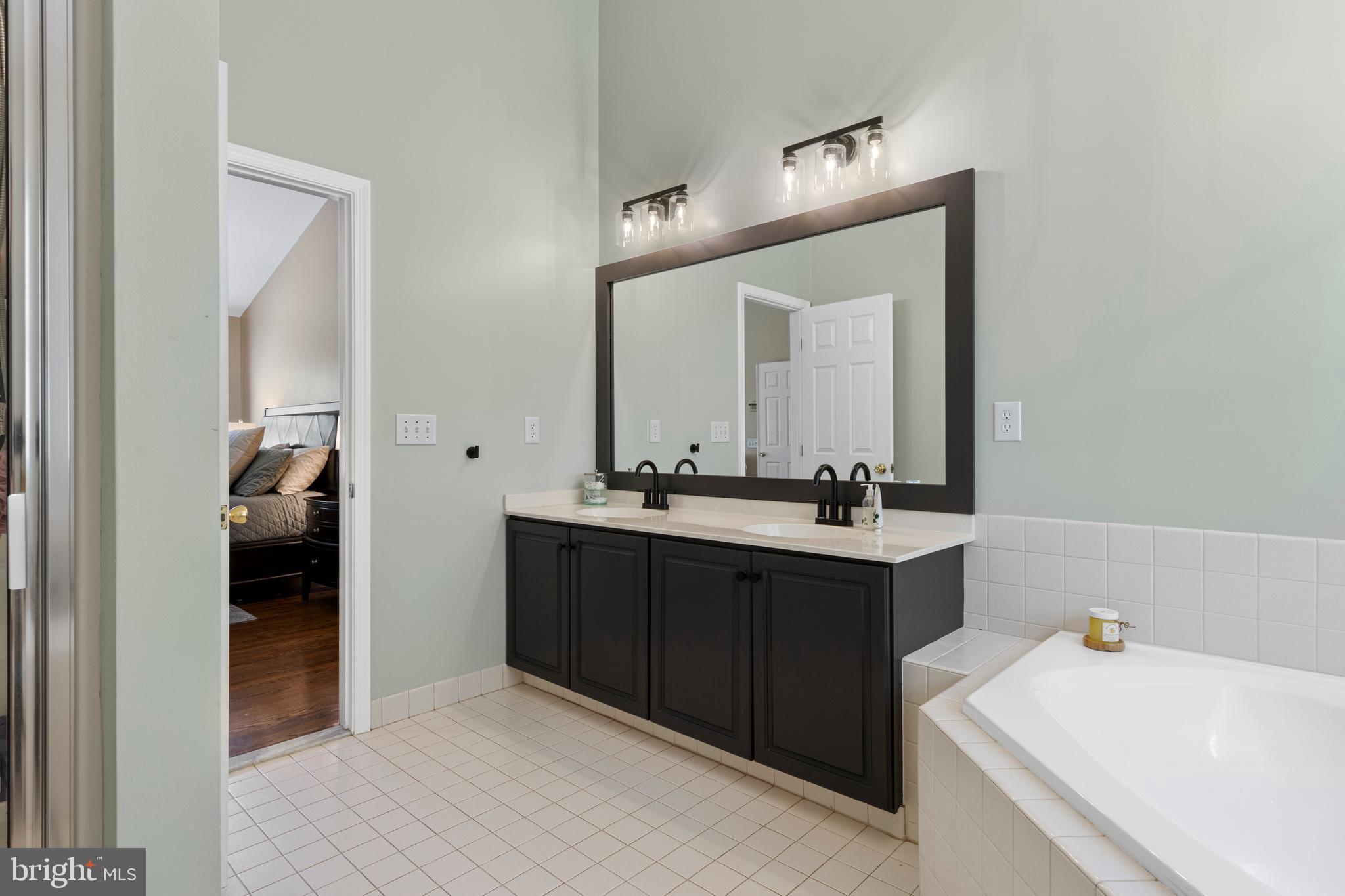 427 Buttonwood Road Landenberg, PA 19350 - Photo 57 of 82 a en suite bathroom with a sink and a mirror
